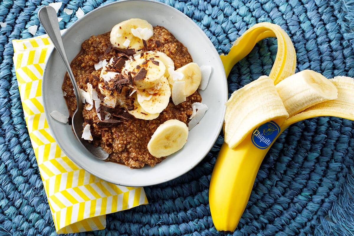 Chocolate quinoa breakfast with banana, cacao, chocolate & coconut