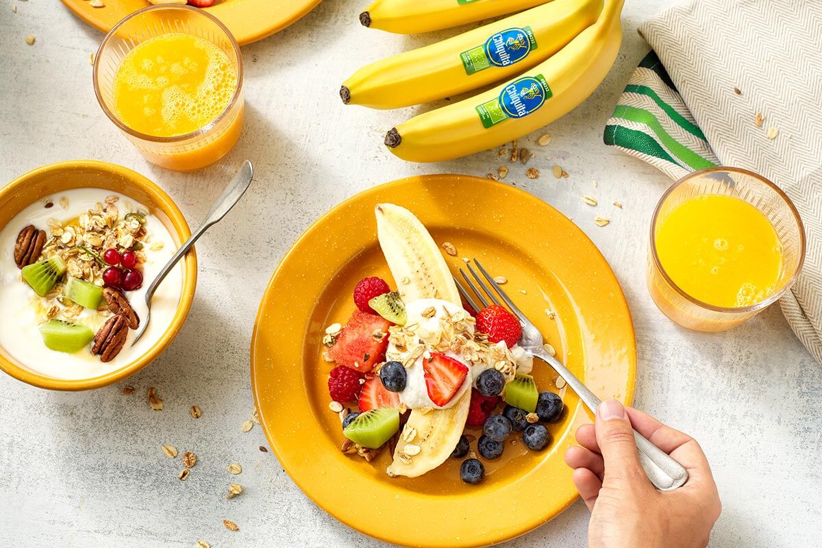 Healthy fruit salad with organic Chiquita Banana and granola banana yogurt