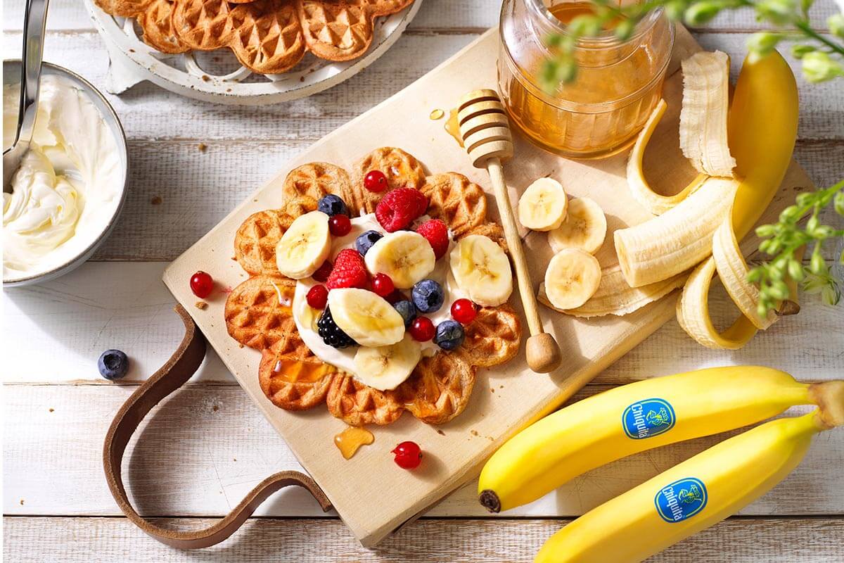 Homemade Whole grain Healthy Breakfast Waffles with Chiquita Banana and Red Fruit