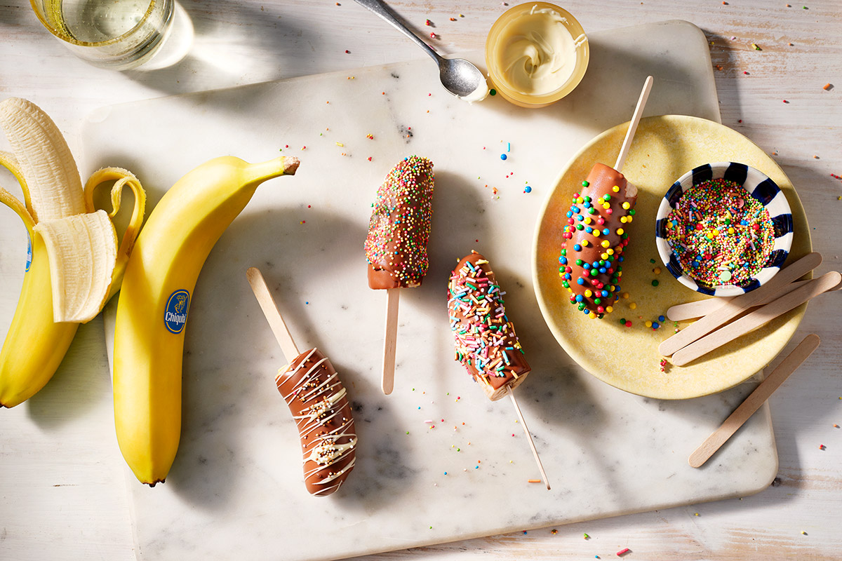 Frozen Chocolate covered banana pops with (colored) sprinkles